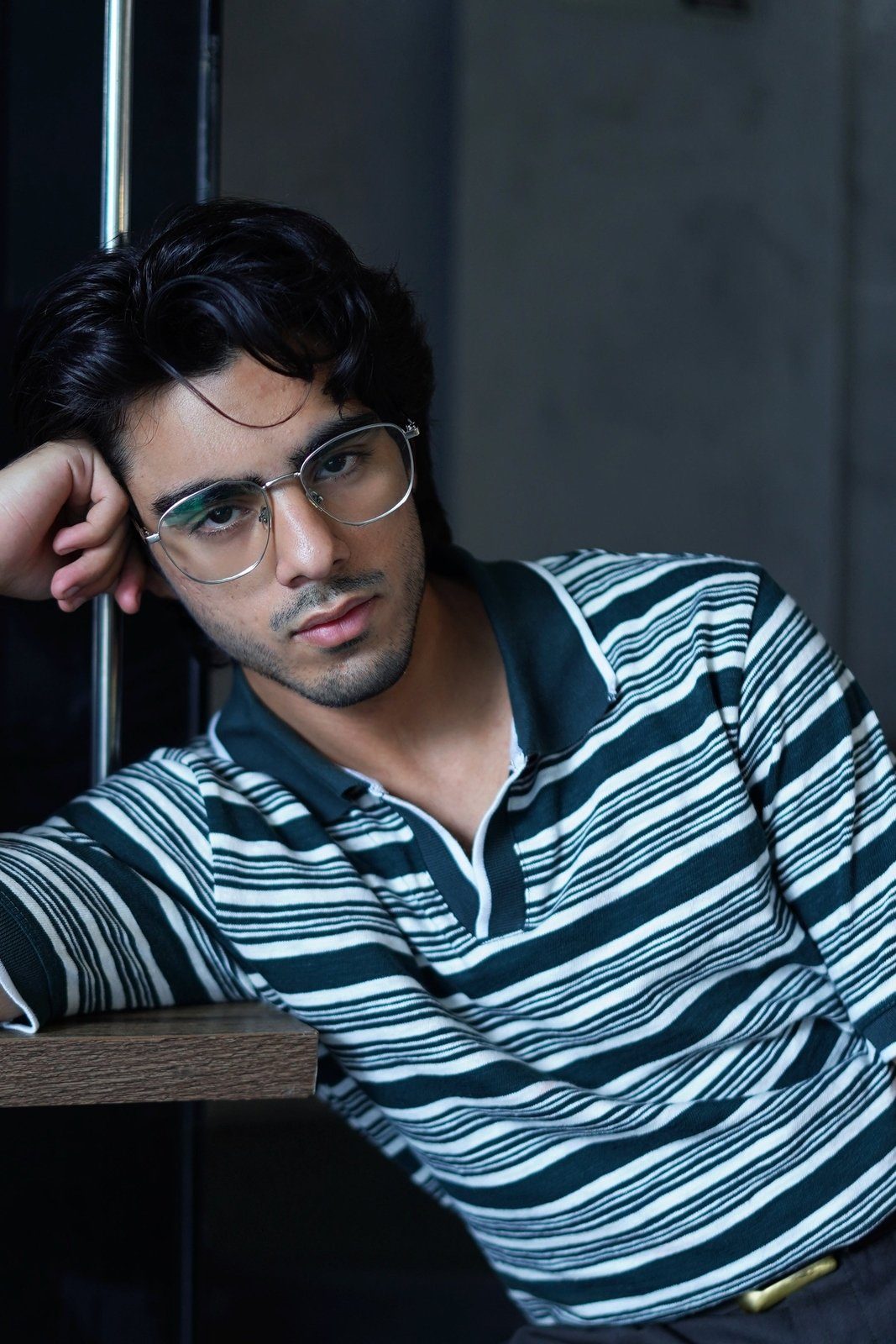 Green striped knit polo fabric close up - Soch